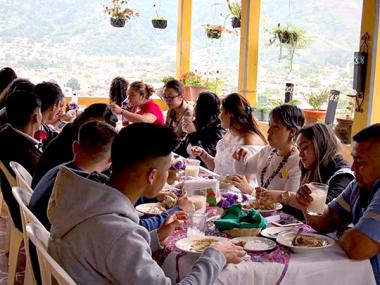 A group of friends enjoying a meal at a restaurant