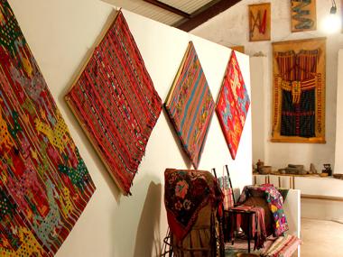 Multiple tapestries hung on a wall